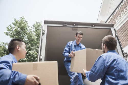 Professional movers assisting with truck loading in Tooting